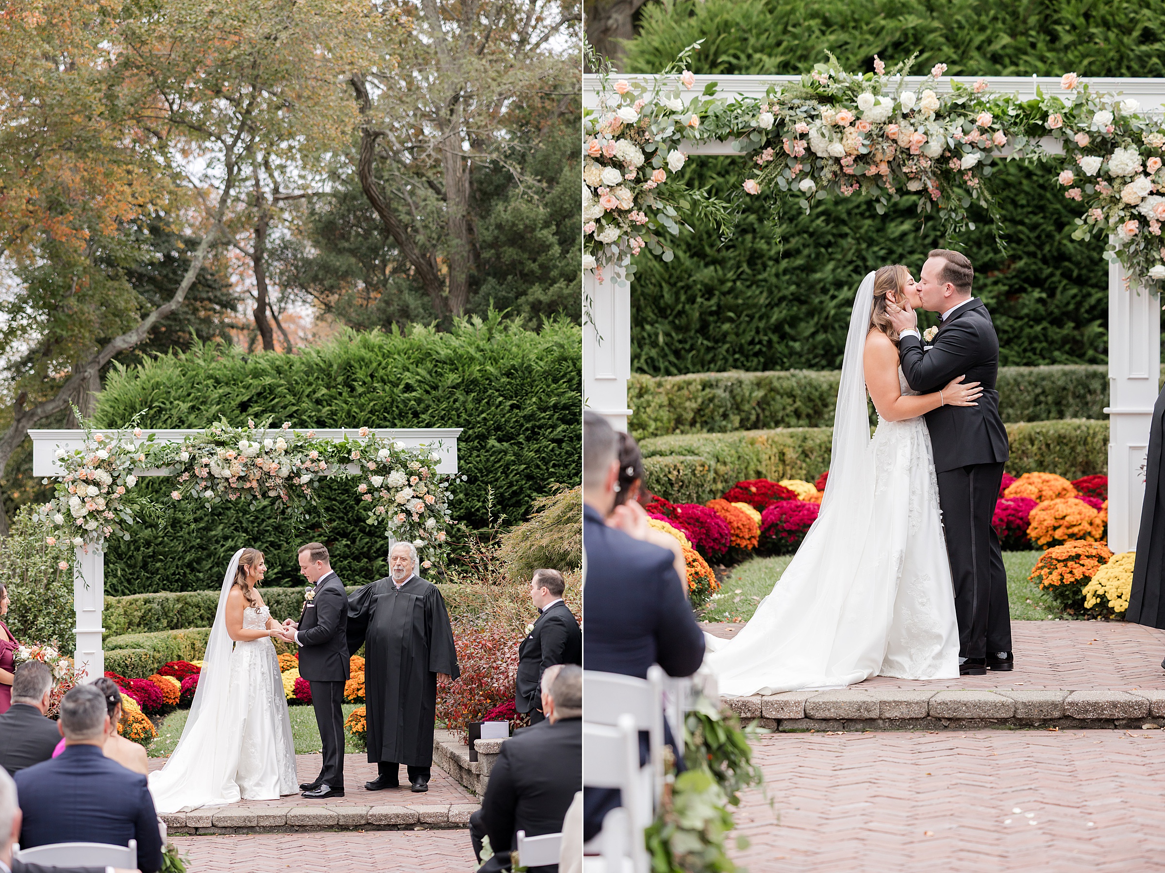 Bride and groom exchanging vows beneath a flower-covered arch, then sharing a tender first kiss surrounded by lush greenery and vibrant autumn blooms.
