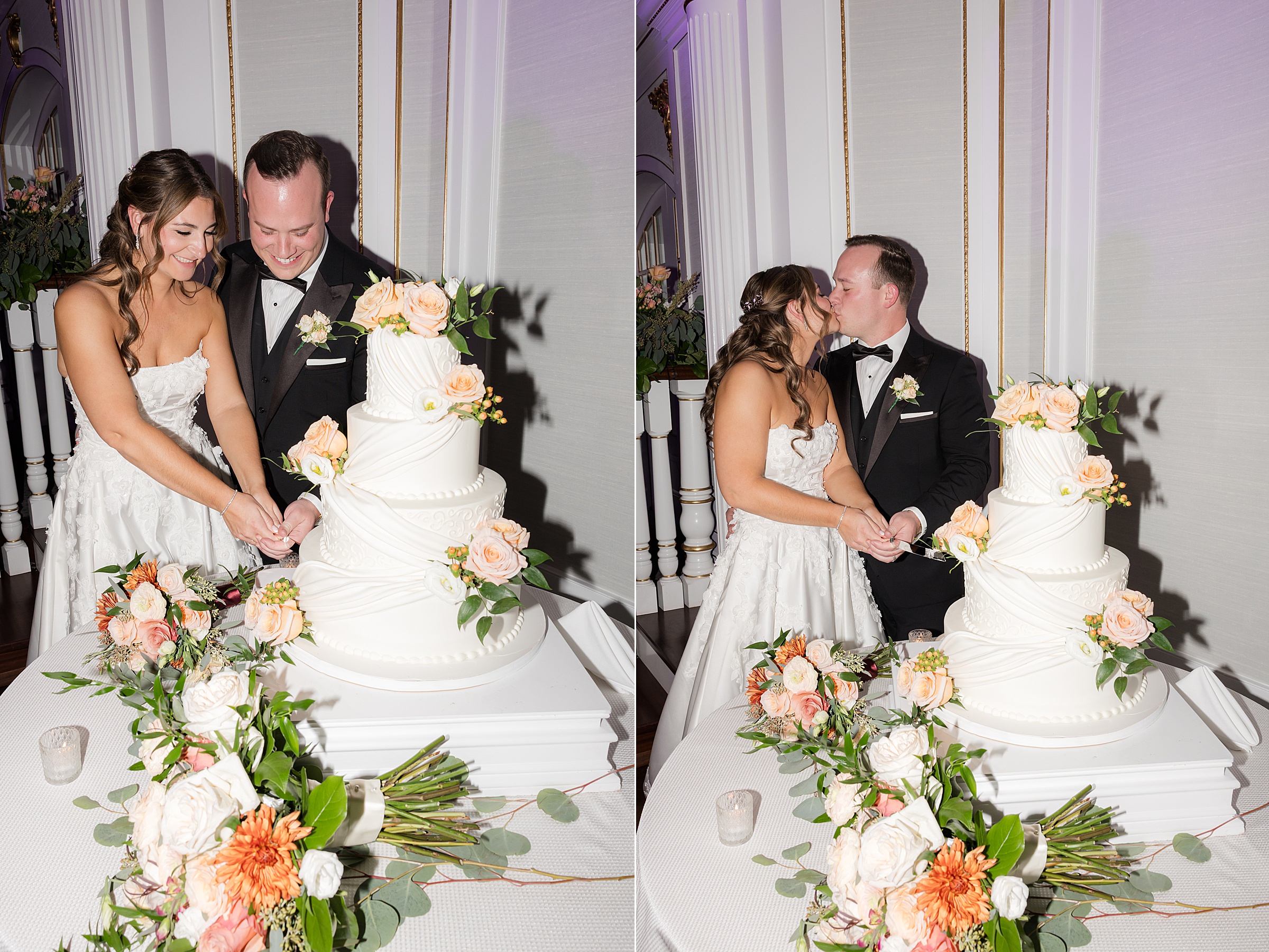 Bride and groom cutting their tiered wedding cake, followed by a kiss beside it.