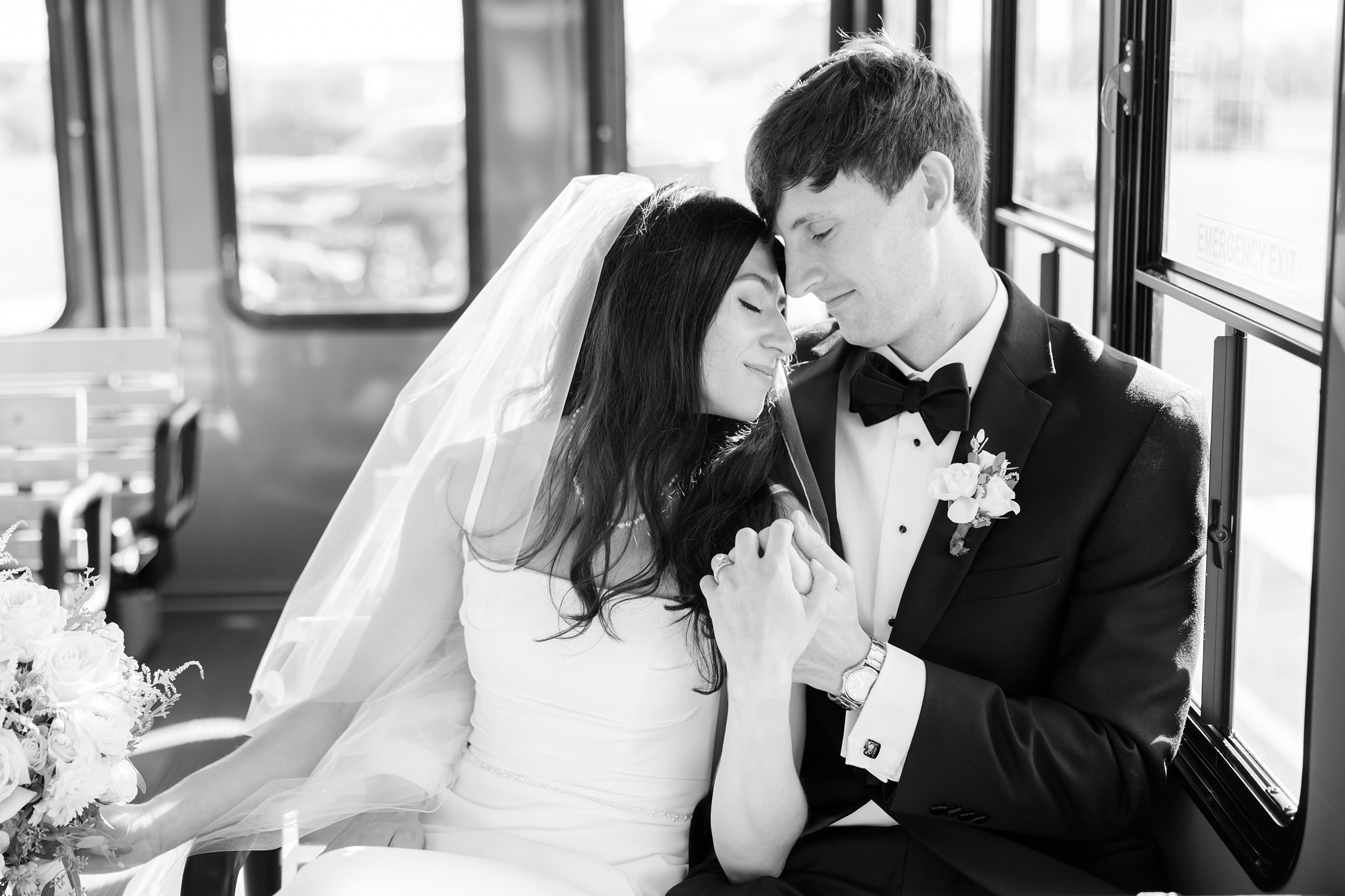 Bride rests her head gently against the groom’s, their hands intertwined as they share a peaceful, deeply affectionate moment together.