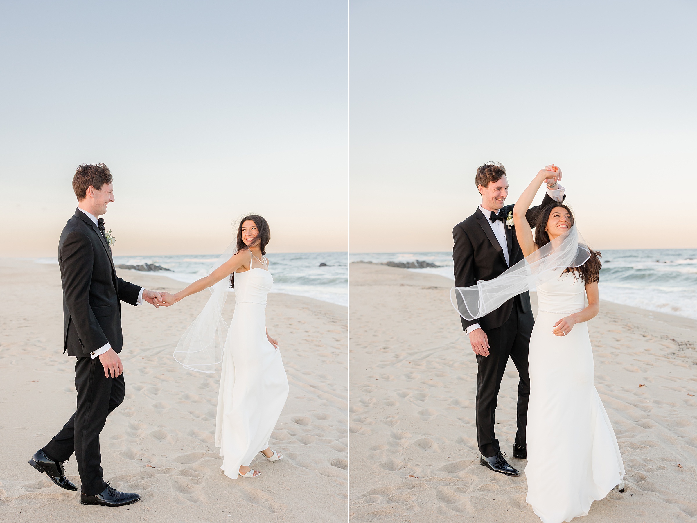 Groom leads his bride by the hand along the sandy shoreline as she smiles back, then twirls her playfully beneath his arm, her veil catching the ocean breeze in a lighthearted, romantic moment.