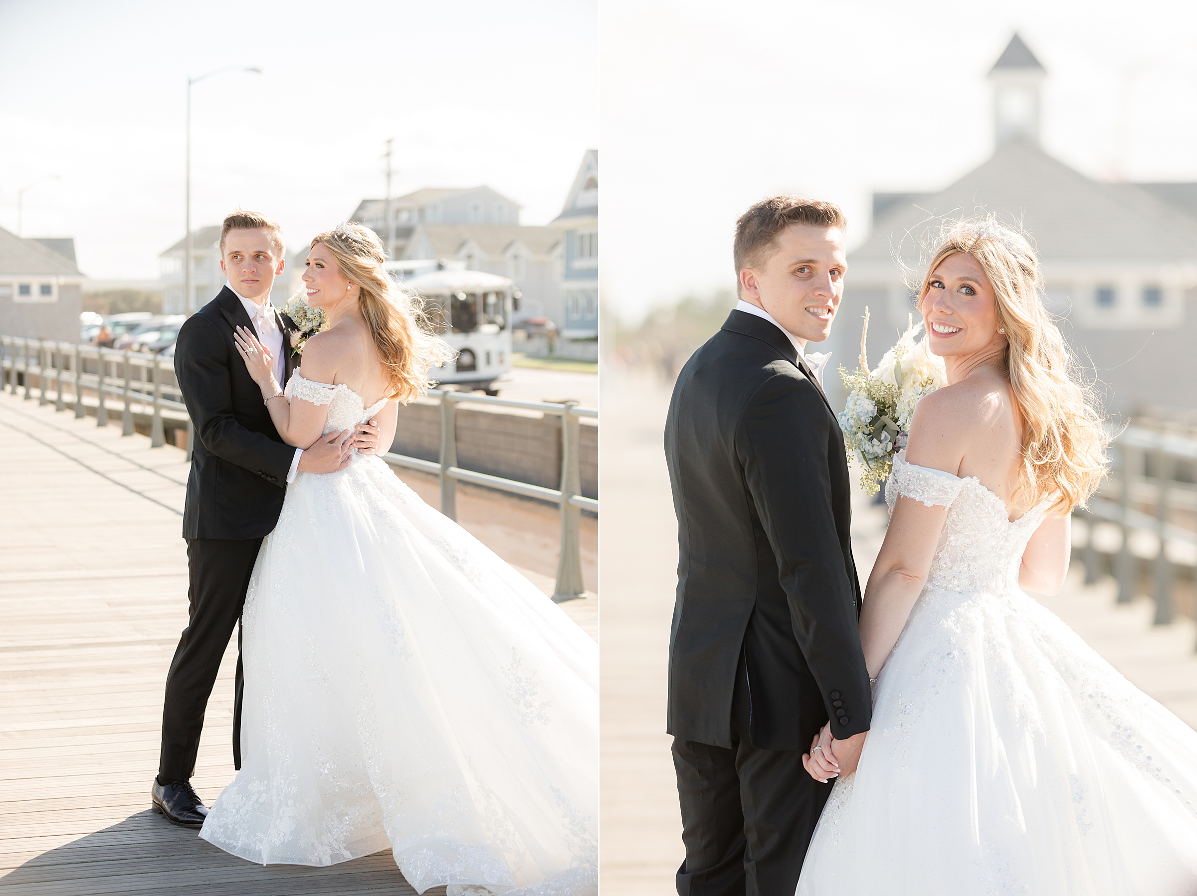 Groom embracing and looking back toward the camera on a bright boardwalk.