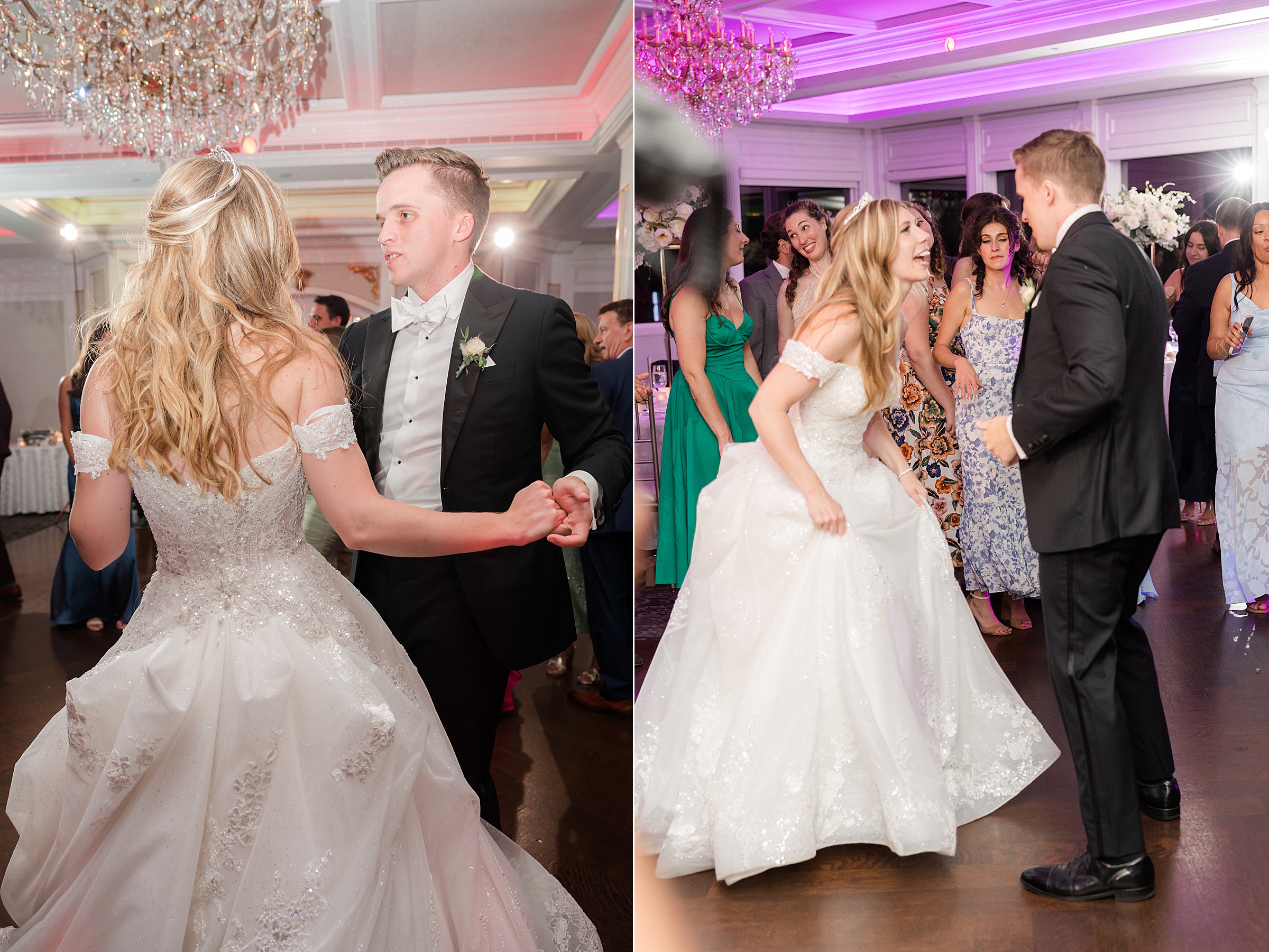 Bride and groom dancing and laughing among guests on the dance floor.