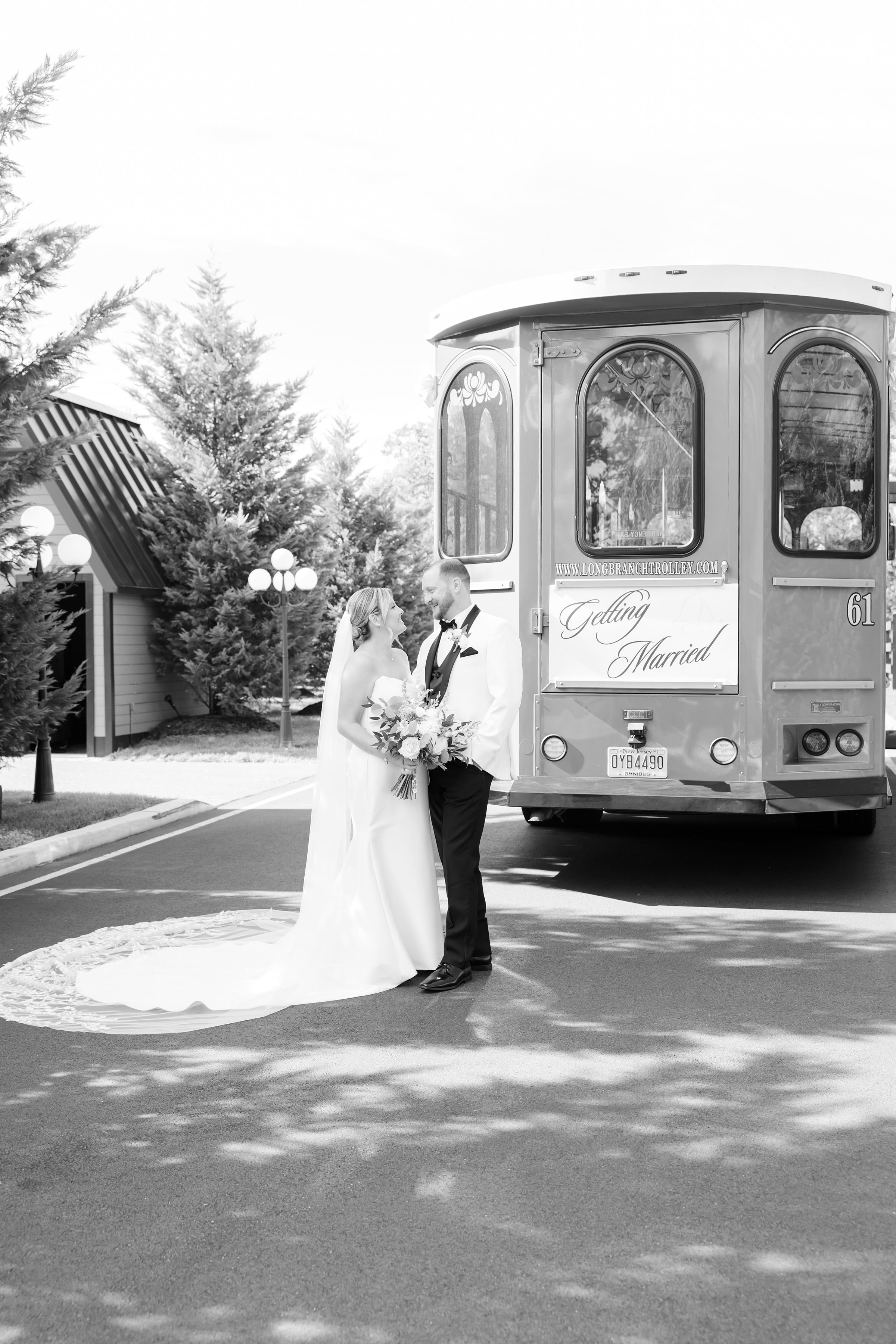 Bride and groom embrace beside the trolley, surrounded by soft light and new beginnings