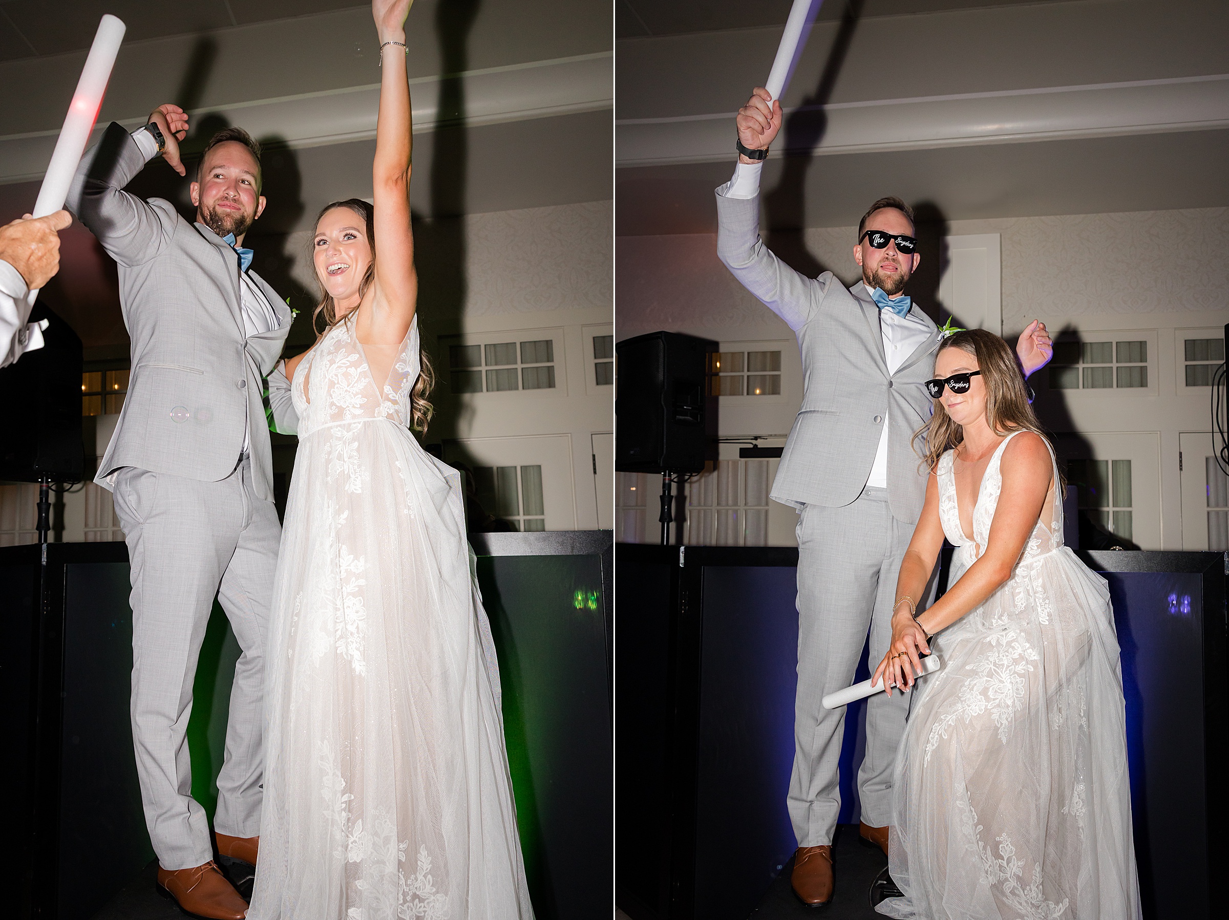 Newlyweds leap into the air together, hands raised in joy, celebrating their first moments on the dance floor