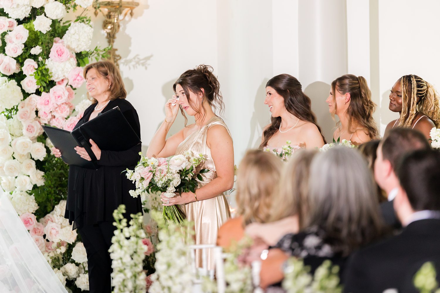 snaps of bridesmaids in teary-eyed state while looking at the bride and groom's union