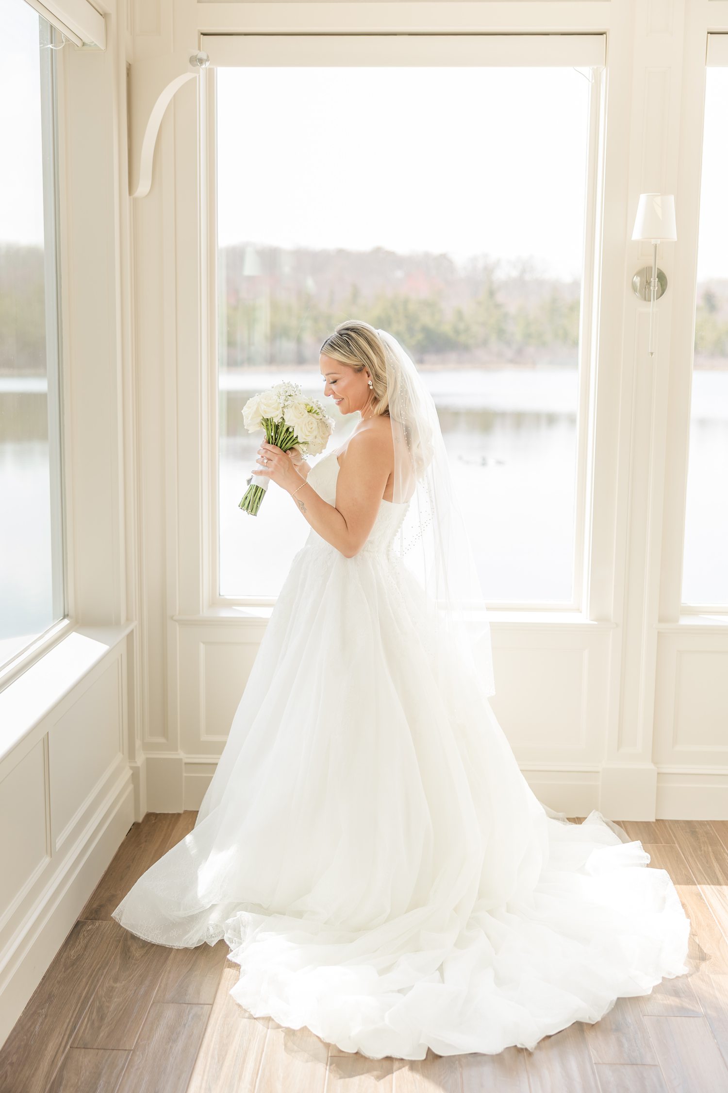 Close-up of bridal bouquet and wedding ring with elegant floral details