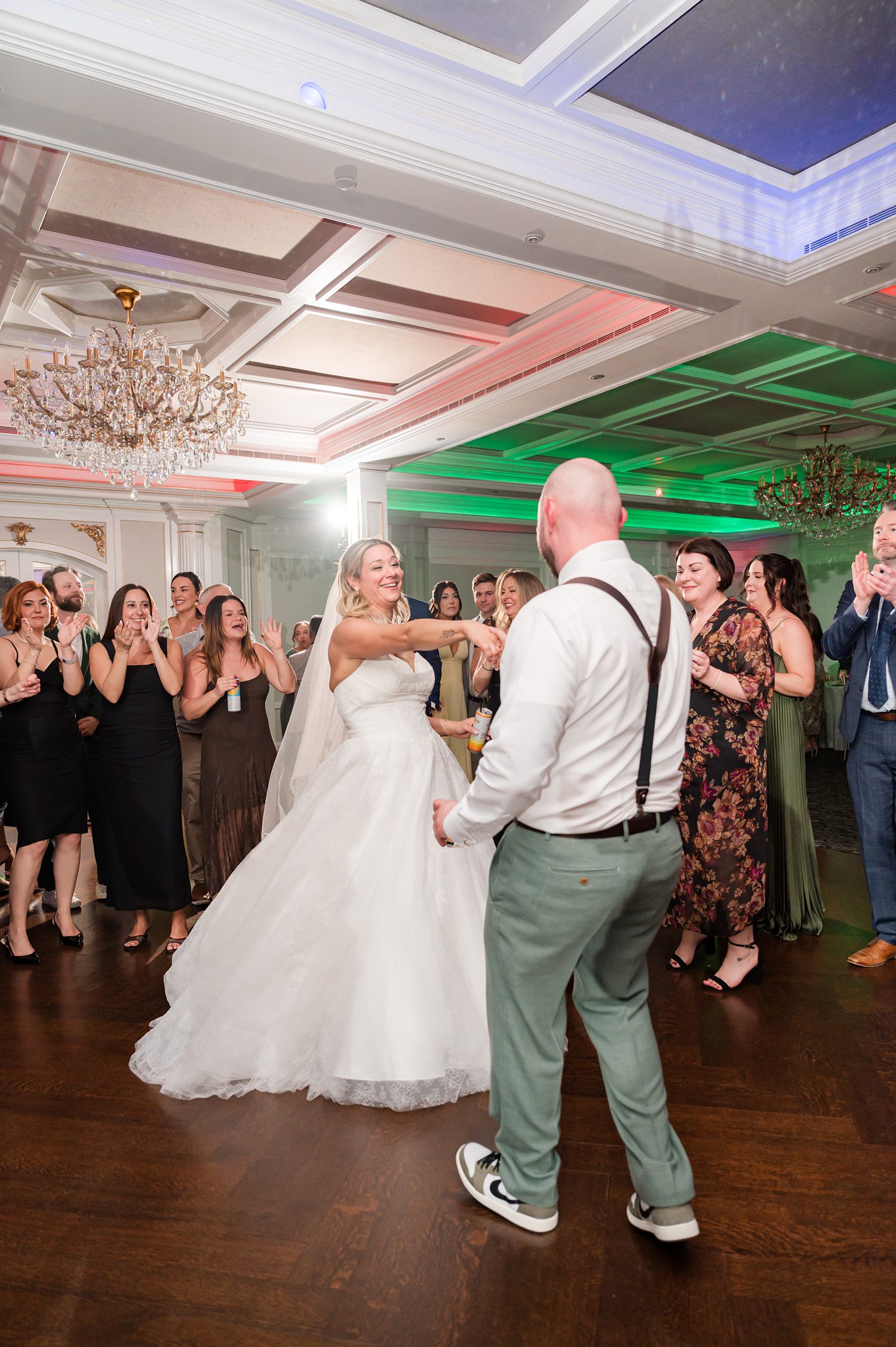 Groom dipping bride during romantic wedding reception dance performance