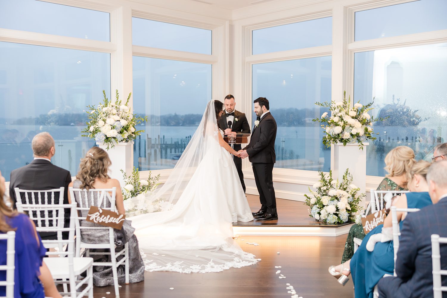 Bride and groom standing at the altar face to face