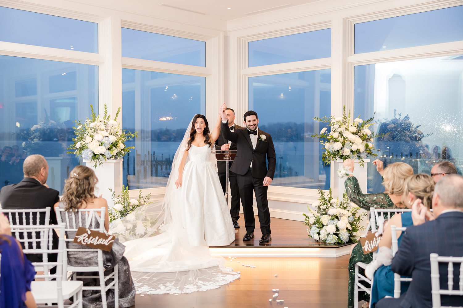 Bride and groom celebrating at the altar