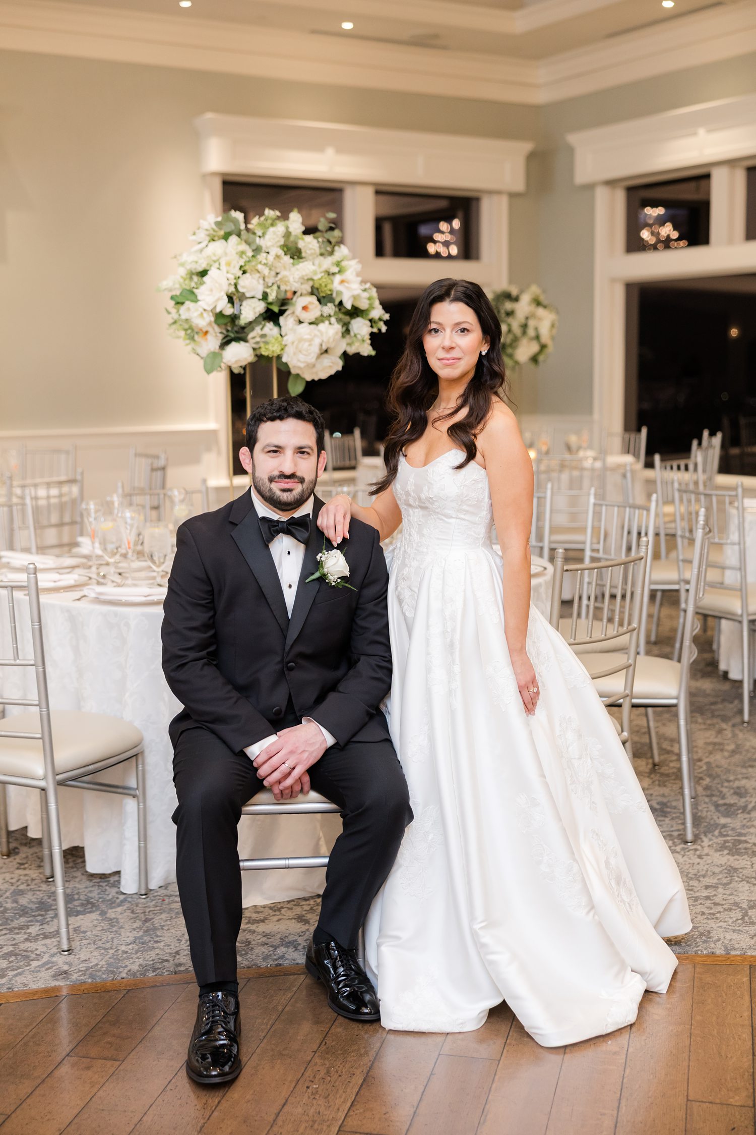 Bride and groom portrait in the reception ballroom after the ceremony