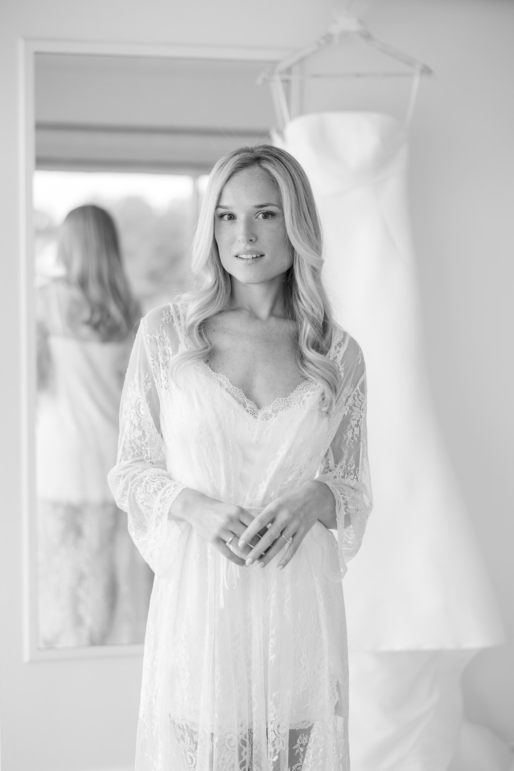 Black and white bridal robe portrait by the window