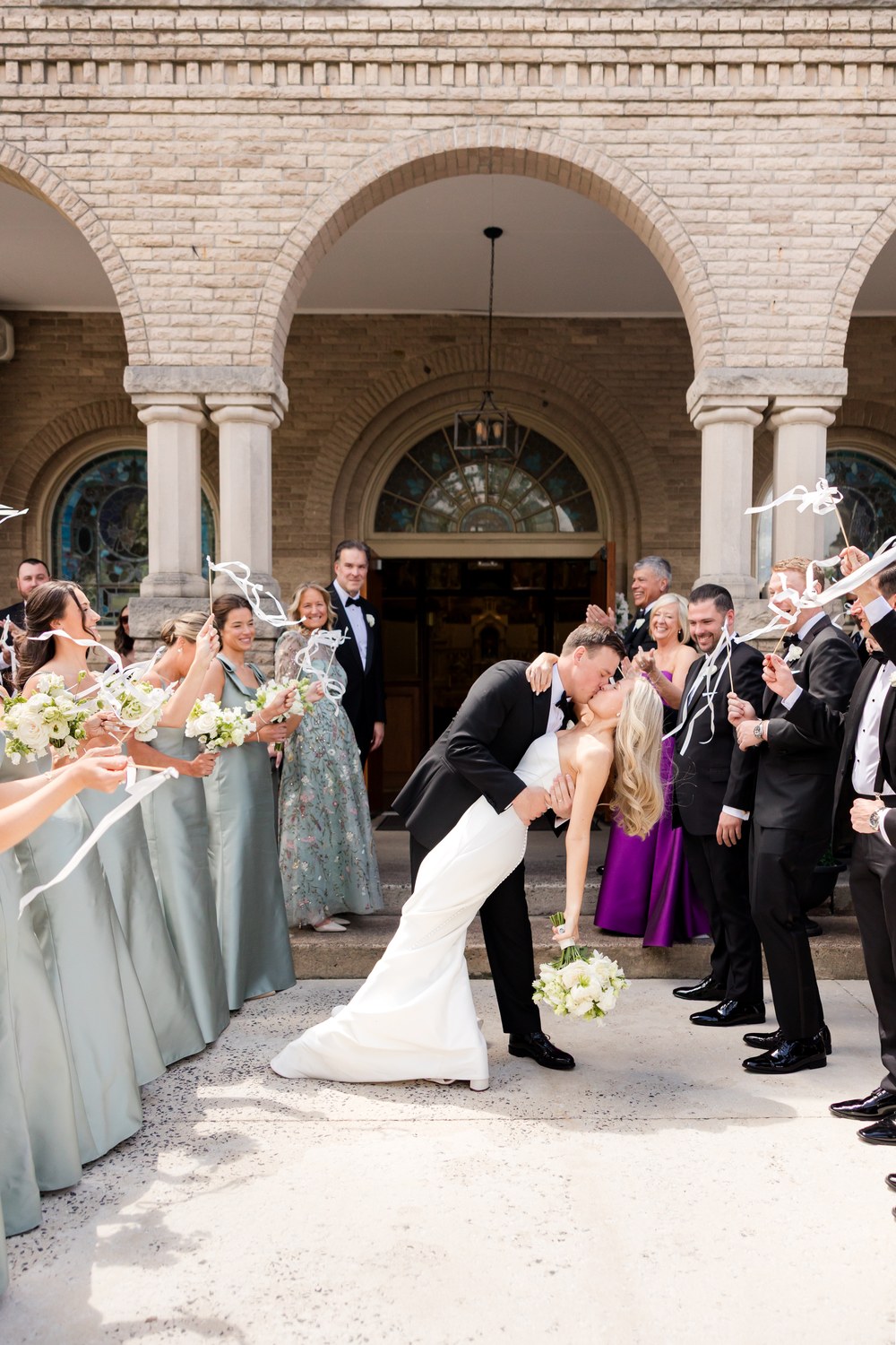 Newlywed kiss outside the church