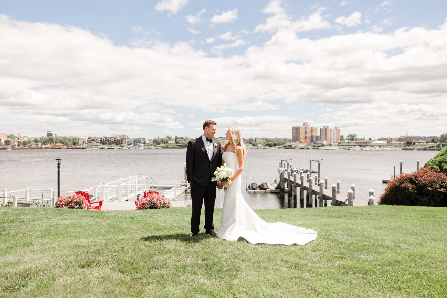 Newlyweds on the waterfront lawn