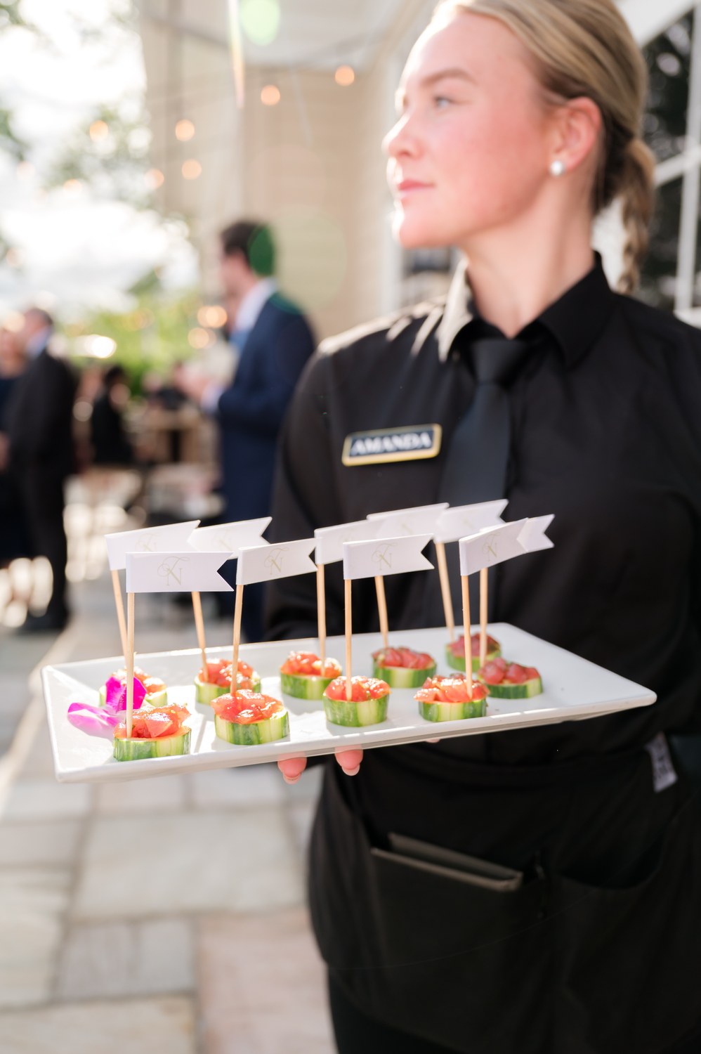 Server with passed hors d'oeuvres at cocktail hour