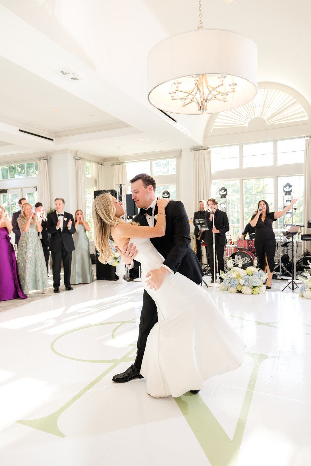 First dance dip on the monogram dance floor