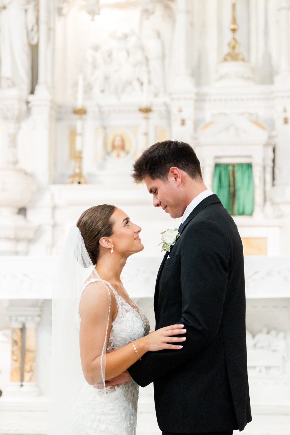 Close-up portrait of the bride and groom inside the church