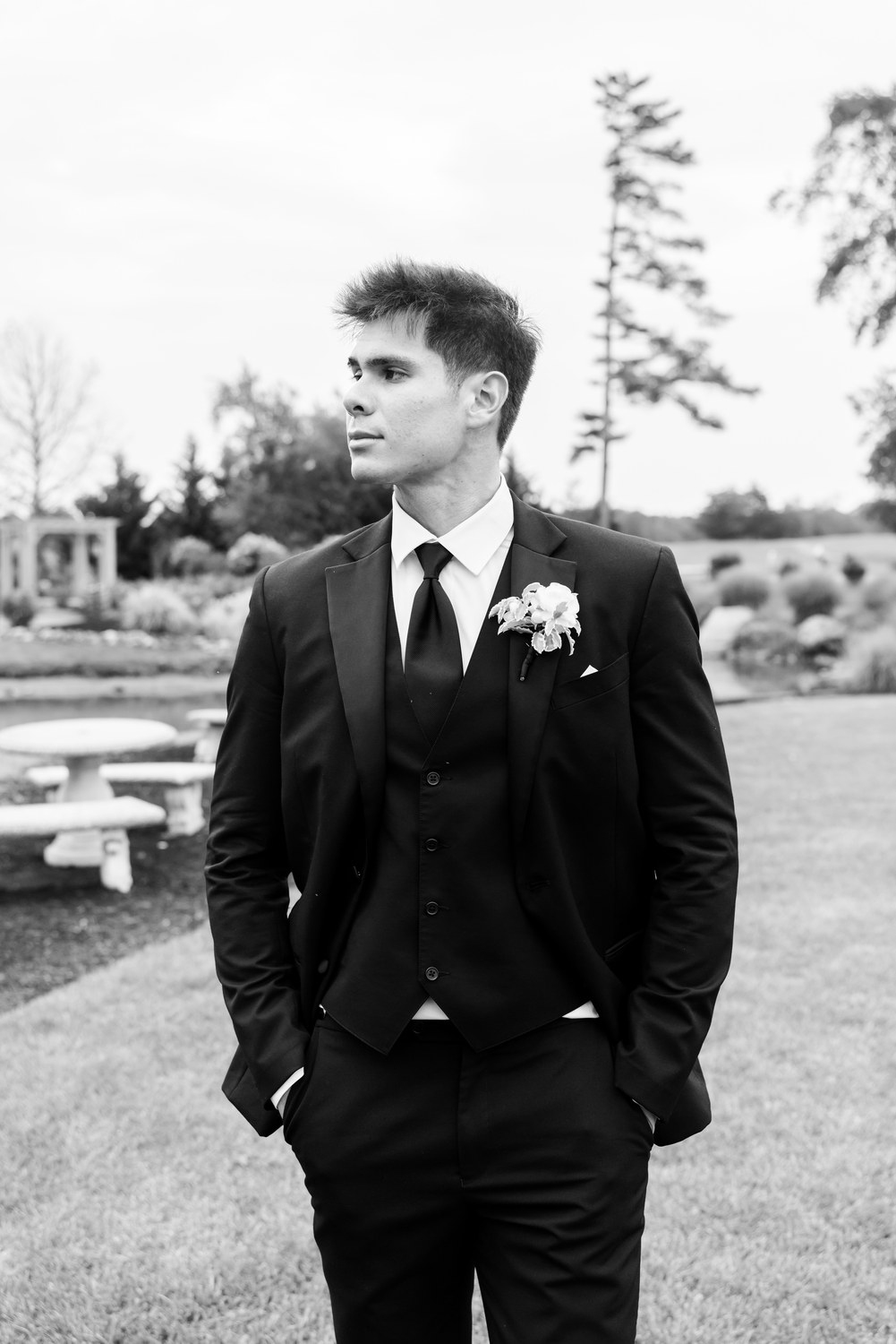 Black and white portrait of the groom outdoors