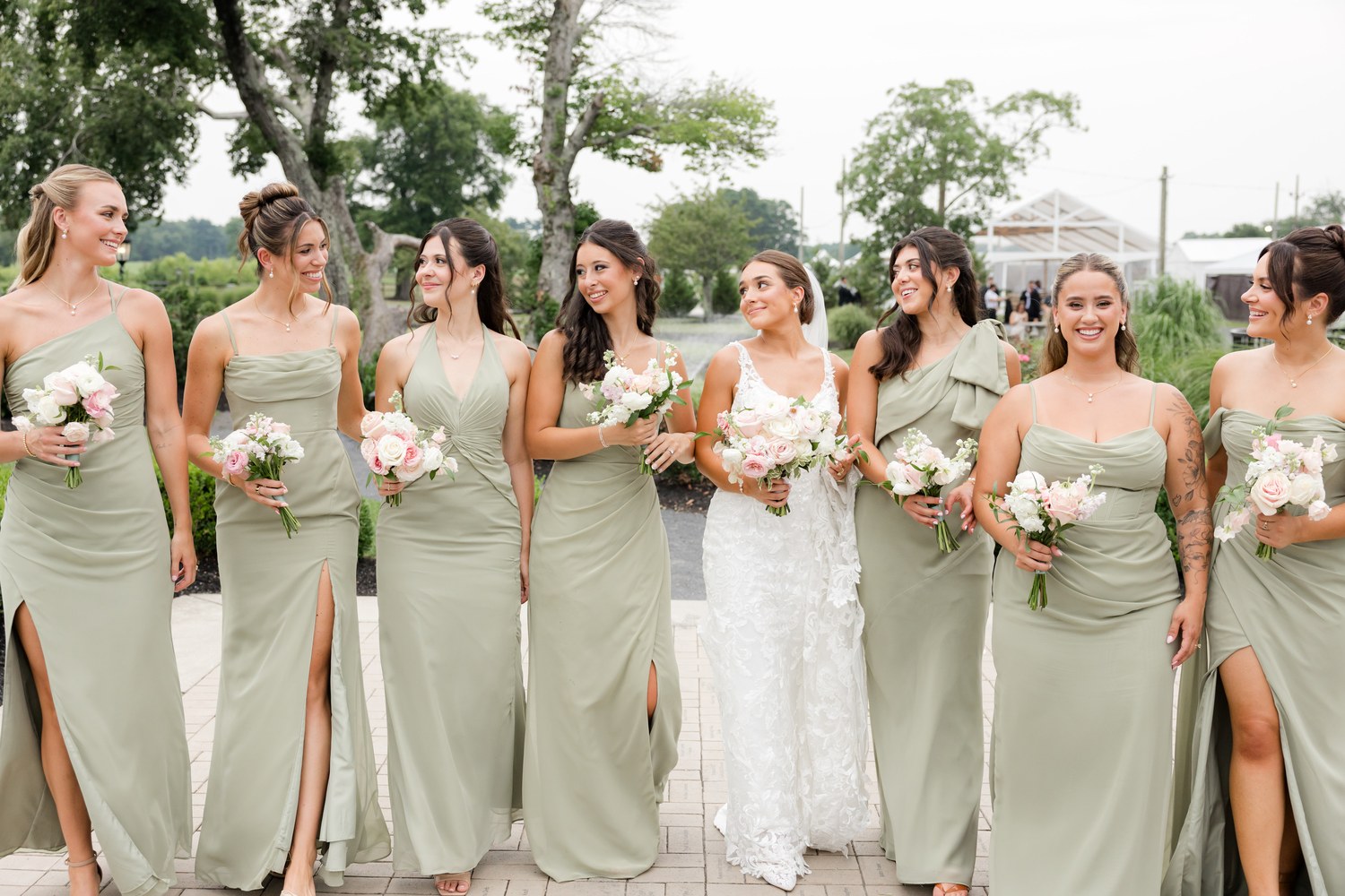 The bride with her bridesmaids in sage green dresses at Renault Winery