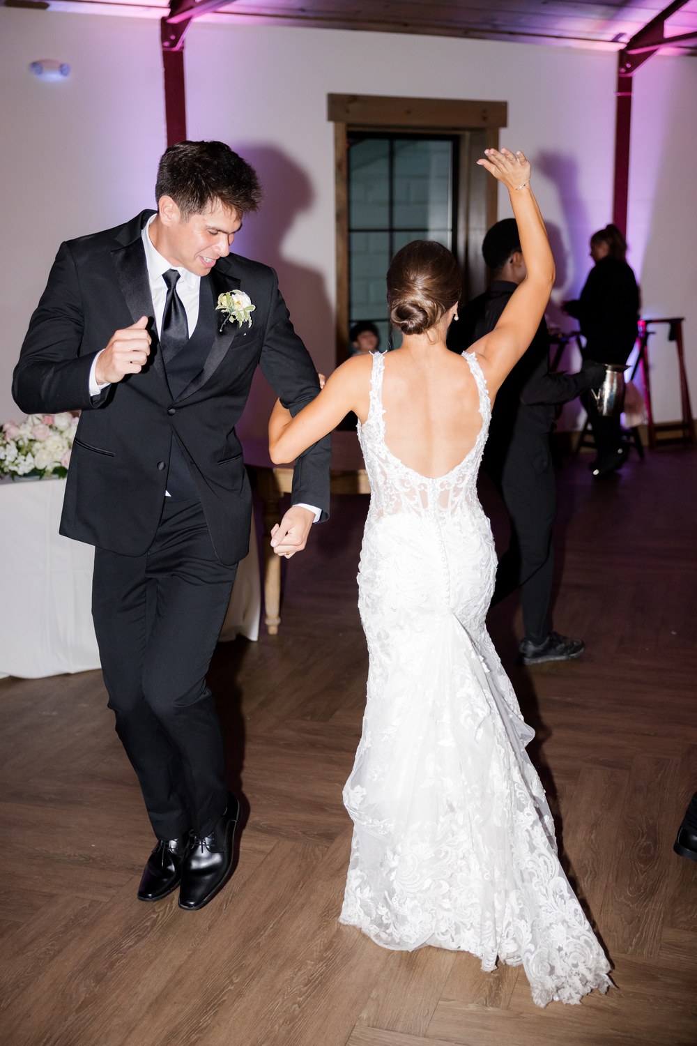 The groom dancing at the wedding reception