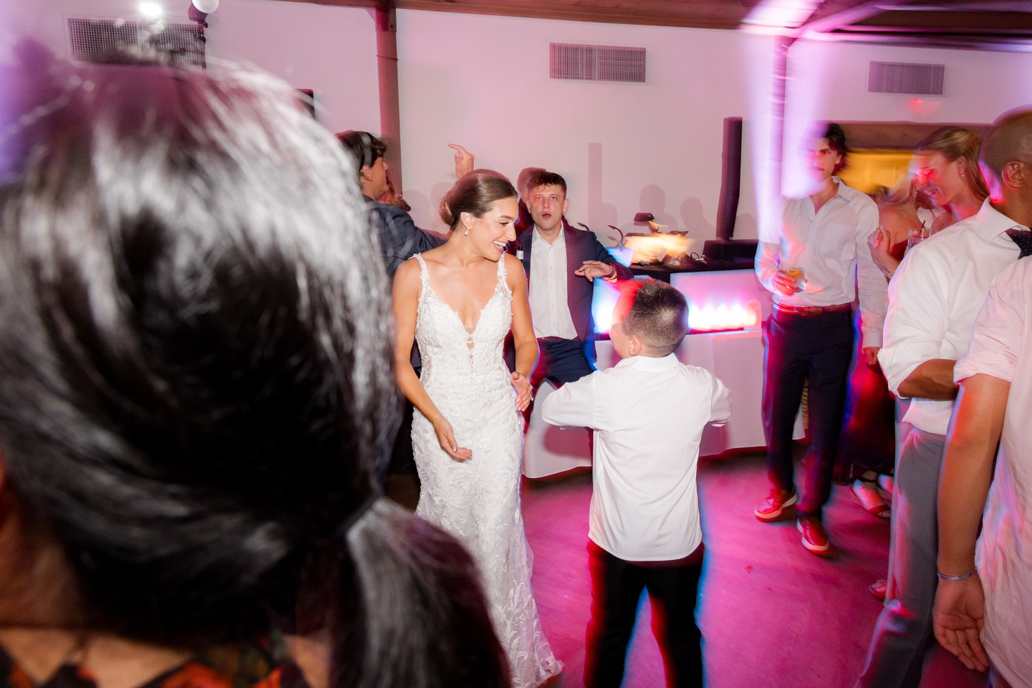 The bride and groom dancing with their guests