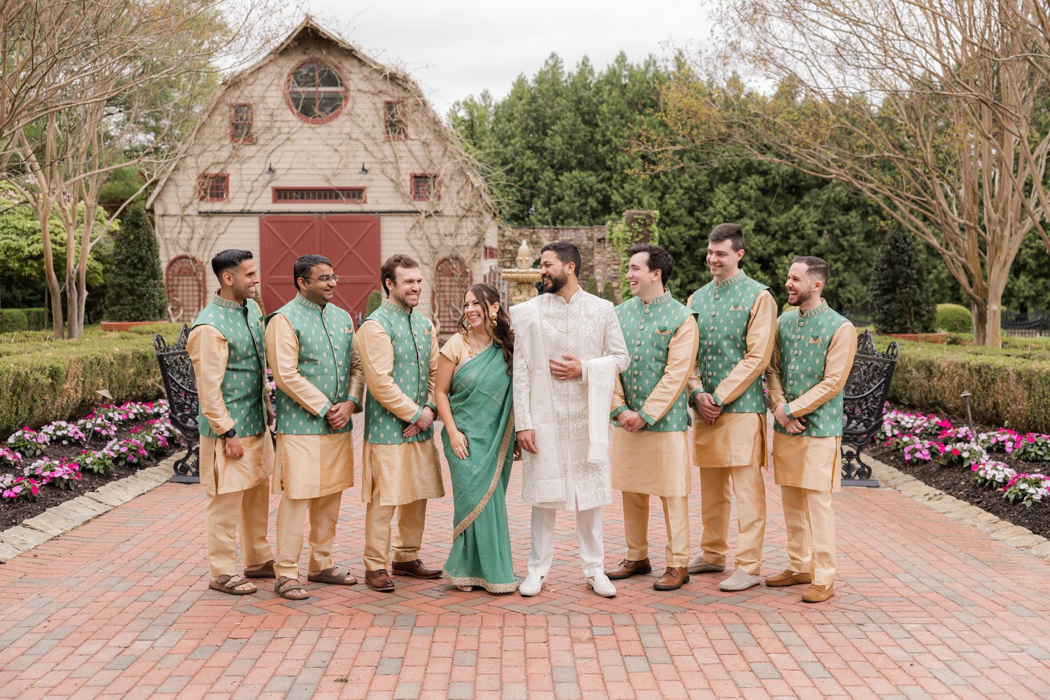 Groom with his groomsmen in green and gold kurtas outside Ashford Estate