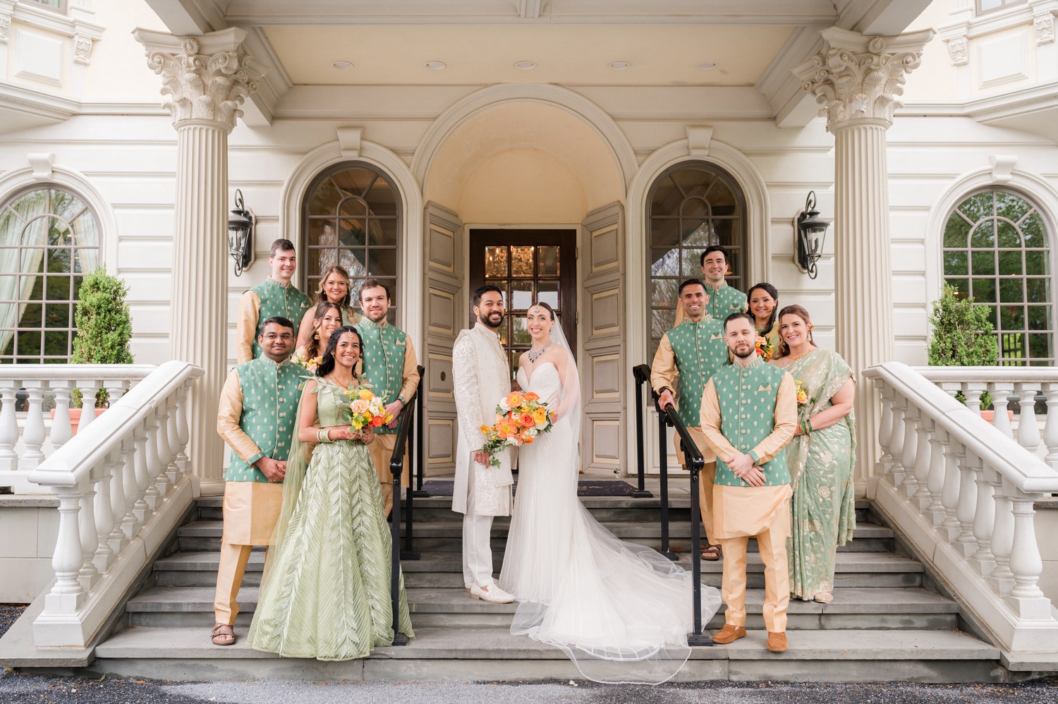 Wedding party group photo on the stone steps at Ashford Estate