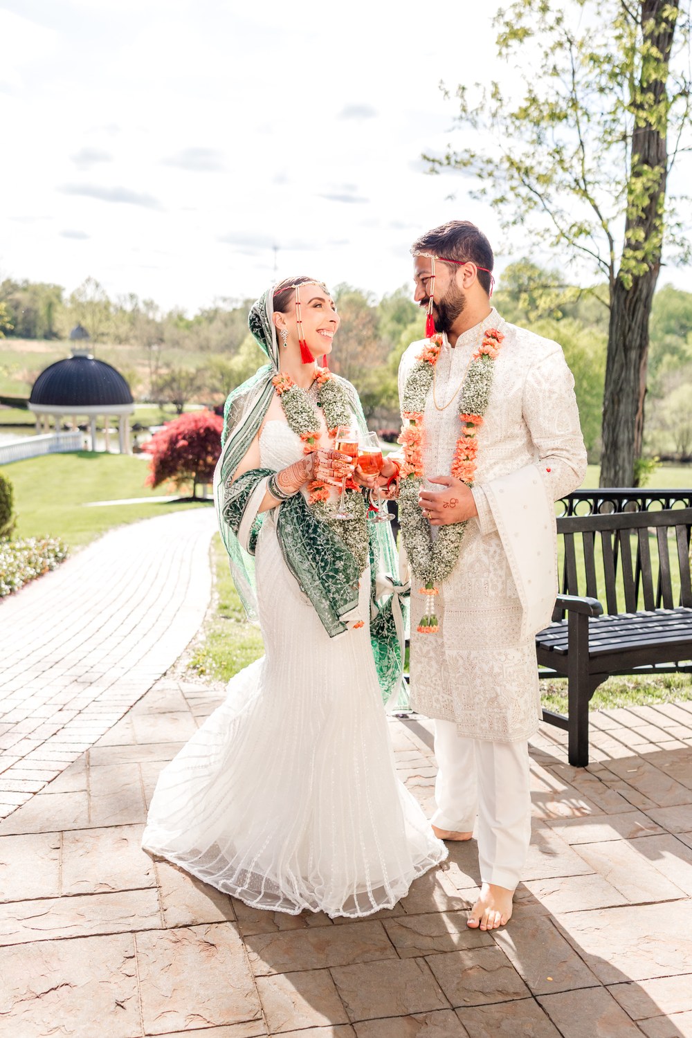 Bride and groom walking together outdoors after their Hindu ceremony at Ashford Estate